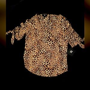 Leopard print short sleeve blouse size small.